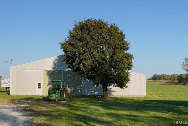 exterior space with a rural view and a lawn