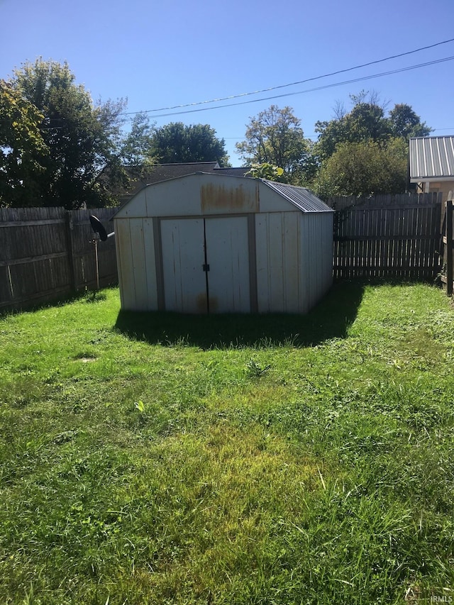 view of outdoor structure featuring a lawn