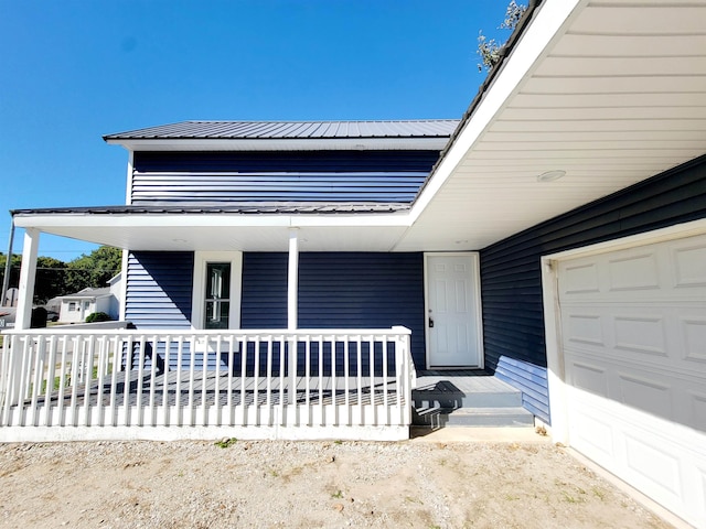 view of front facade with a garage and covered porch