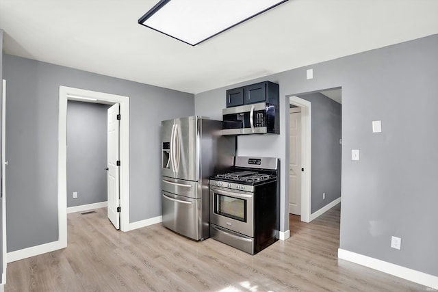 kitchen with appliances with stainless steel finishes and light wood-type flooring