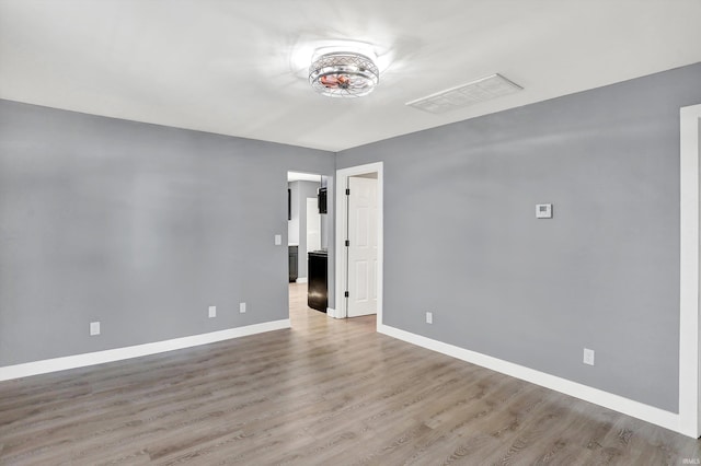 unfurnished room featuring light wood-type flooring