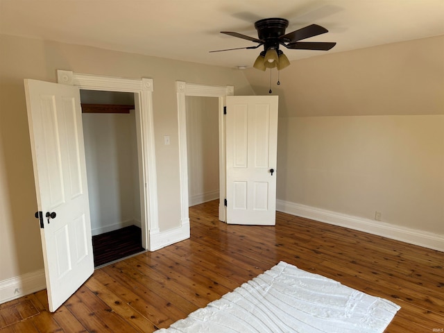 bedroom featuring lofted ceiling, ceiling fan, dark wood-type flooring, and a closet