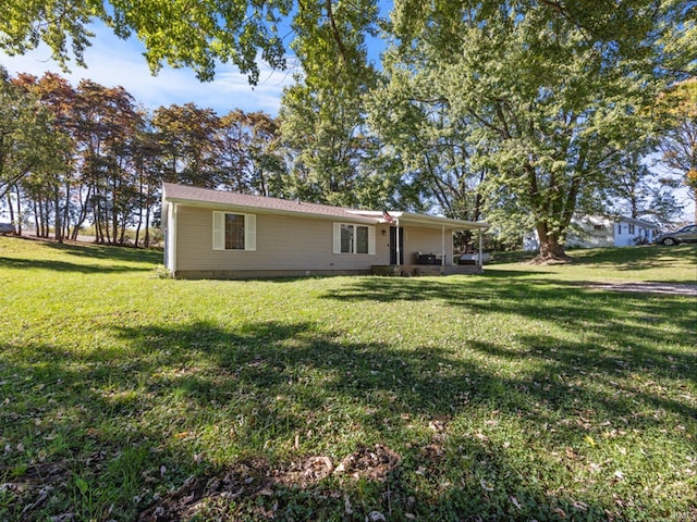 exterior space with a patio and a front lawn