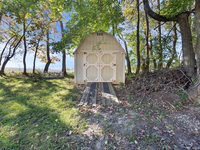 view of outdoor structure with a lawn