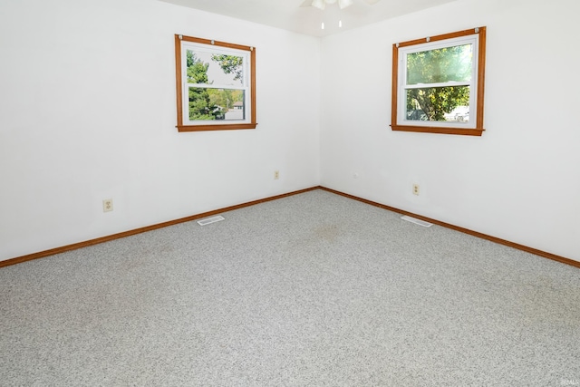 carpeted empty room with ceiling fan