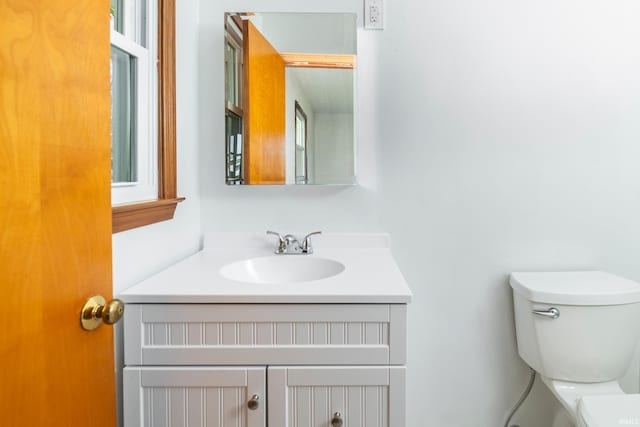 bathroom with vanity and toilet