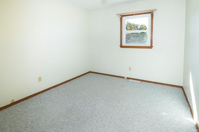 unfurnished room featuring carpet flooring