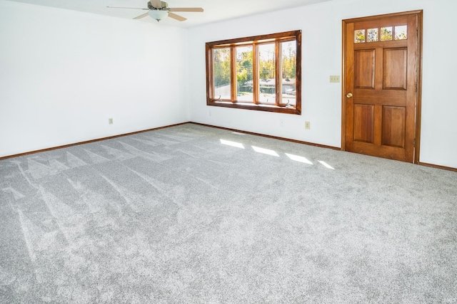 spare room with ceiling fan and carpet floors