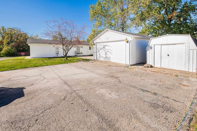 garage with a lawn