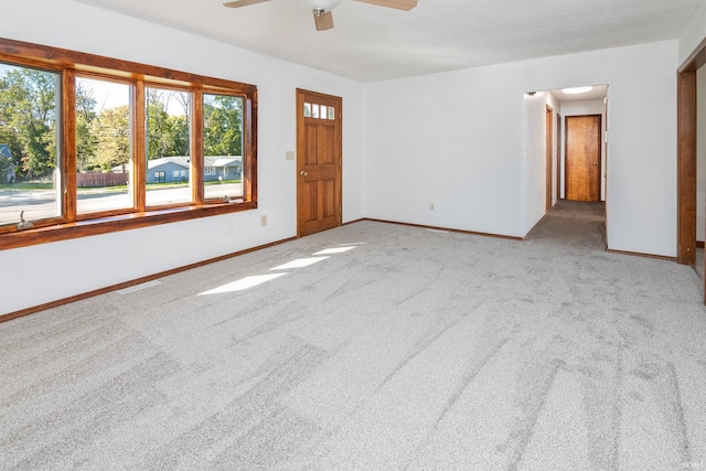 carpeted empty room with ceiling fan