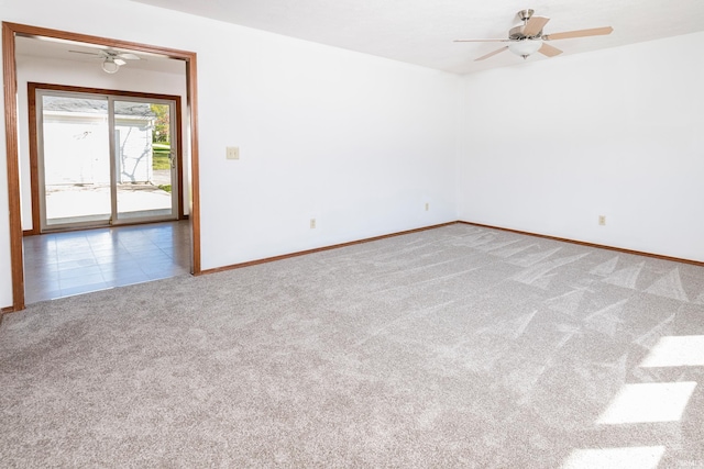 unfurnished room with carpet and ceiling fan