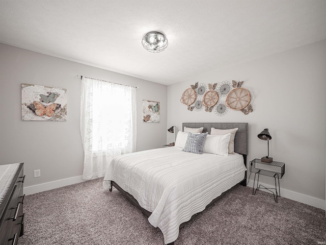 carpeted bedroom with a textured ceiling