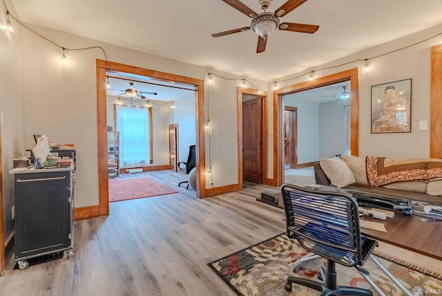 office area with ceiling fan and light hardwood / wood-style flooring