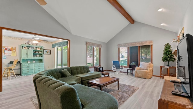 living room featuring high vaulted ceiling, beam ceiling, light hardwood / wood-style flooring, and ceiling fan