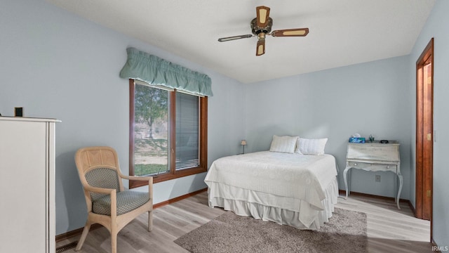 bedroom featuring ceiling fan and light hardwood / wood-style flooring