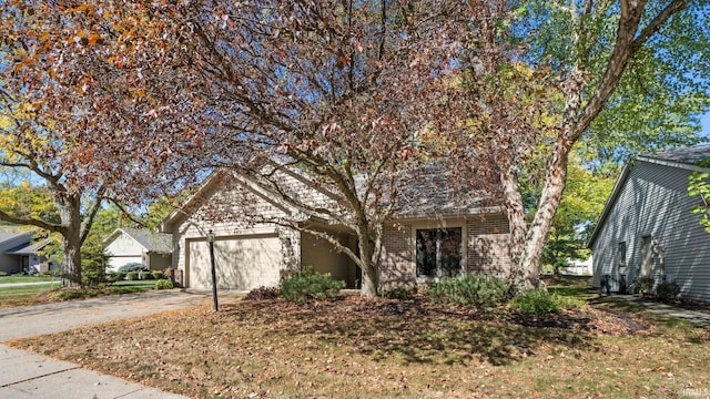 obstructed view of property with a garage