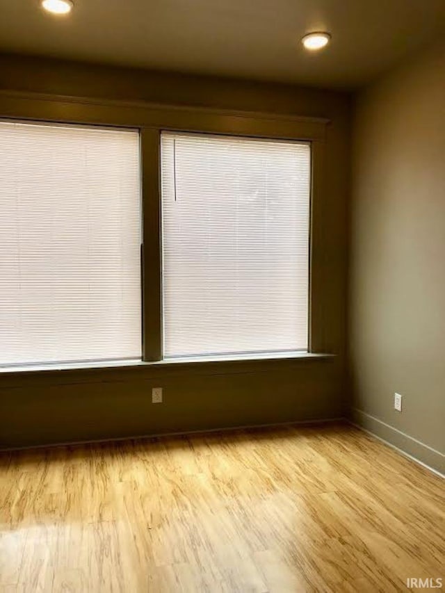 unfurnished room featuring light hardwood / wood-style flooring