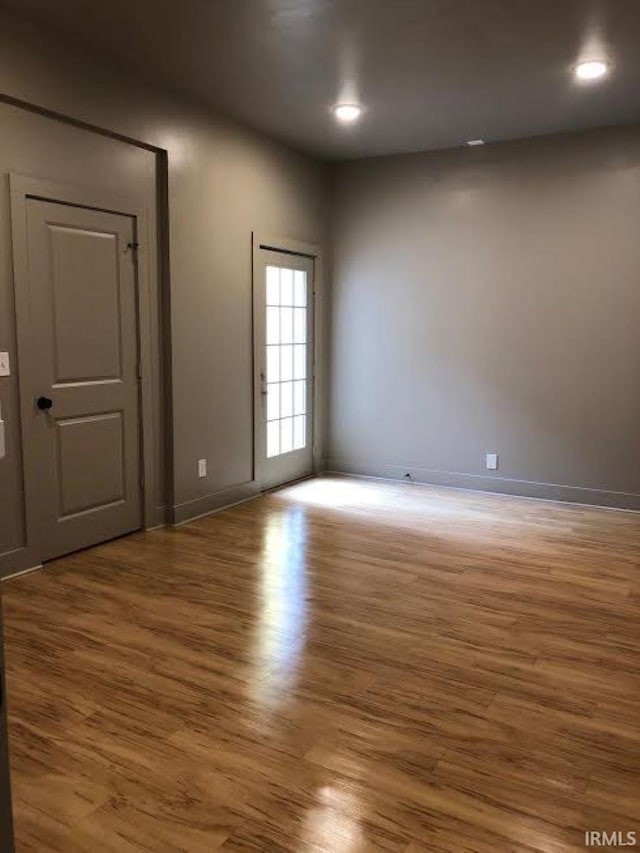 spare room featuring hardwood / wood-style floors