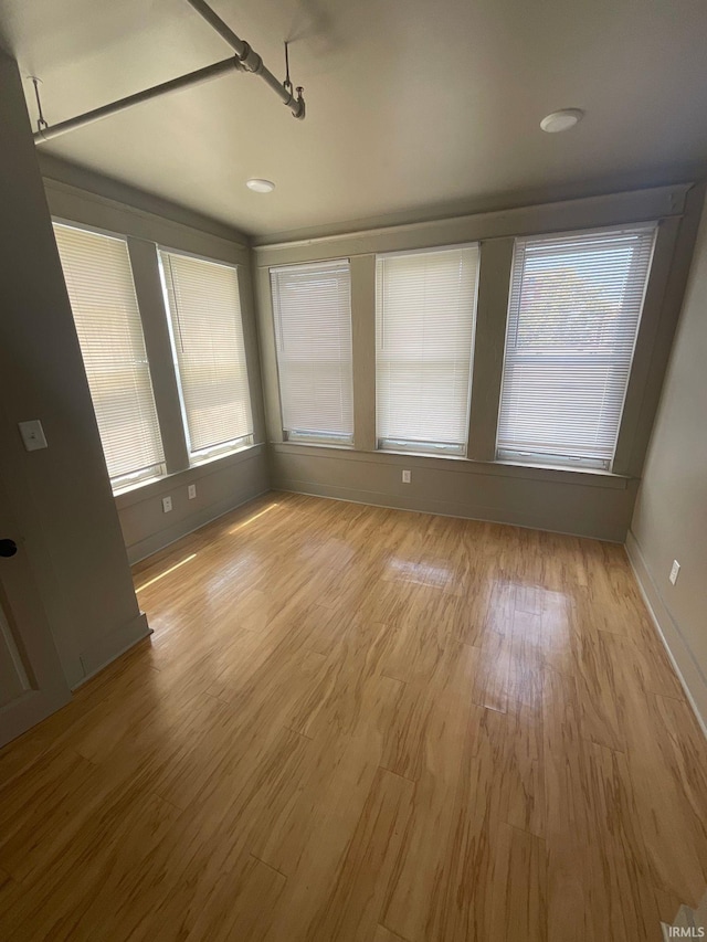 unfurnished dining area with light hardwood / wood-style flooring