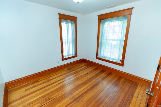 empty room featuring hardwood / wood-style flooring