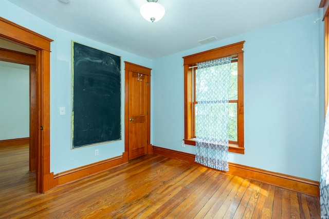 empty room featuring hardwood / wood-style flooring