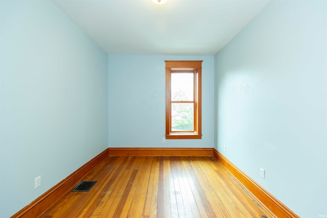 unfurnished room featuring light hardwood / wood-style floors