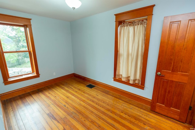 empty room with light hardwood / wood-style floors