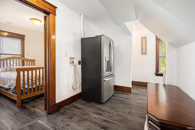 interior space with dark wood-type flooring and stainless steel refrigerator with ice dispenser