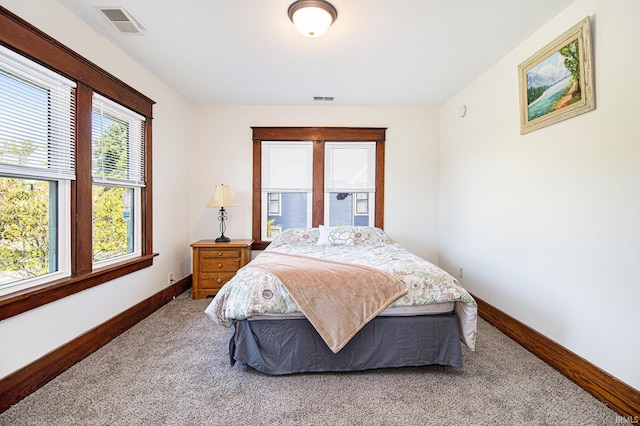 bedroom featuring carpet