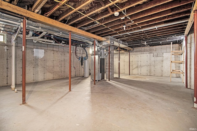 basement with heating unit and water heater