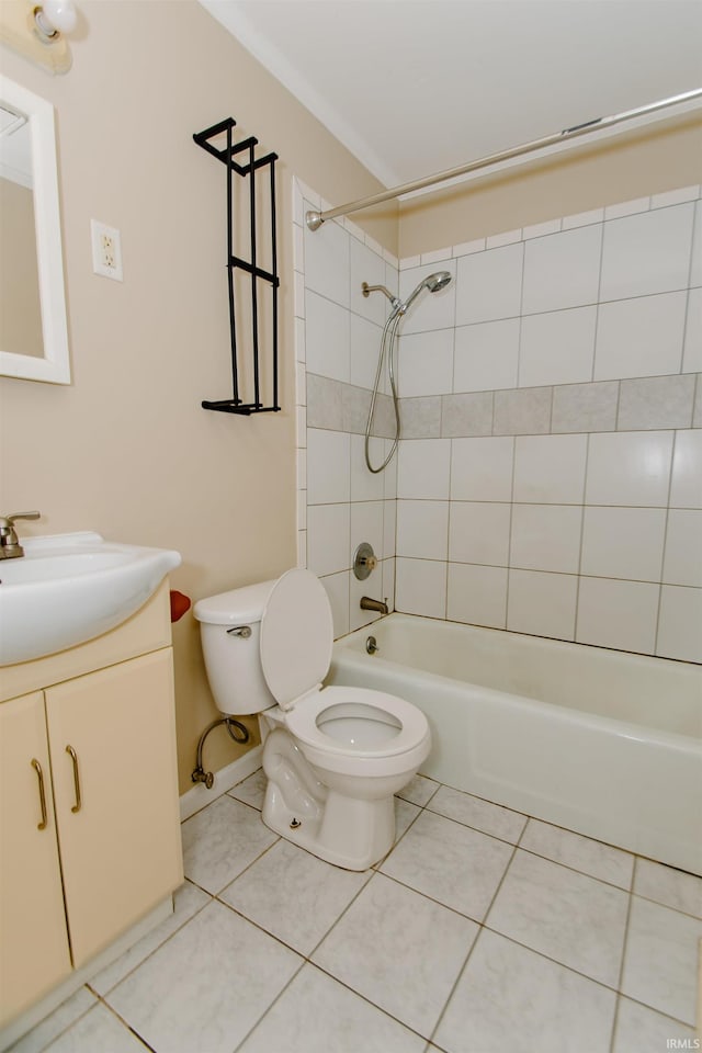 full bathroom with tile patterned flooring, vanity, toilet, and tiled shower / bath combo