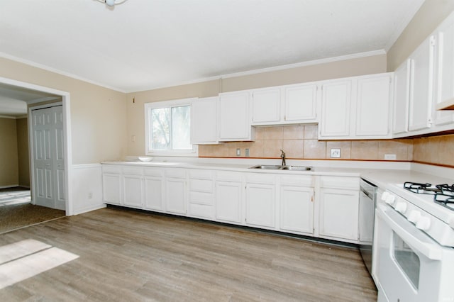 kitchen featuring white cabinets, dishwasher, white range, and sink