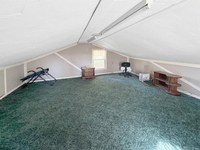 additional living space with lofted ceiling and carpet