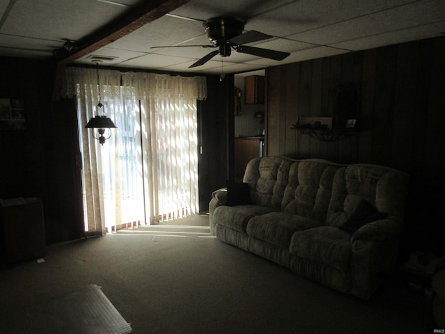 carpeted living room with ceiling fan