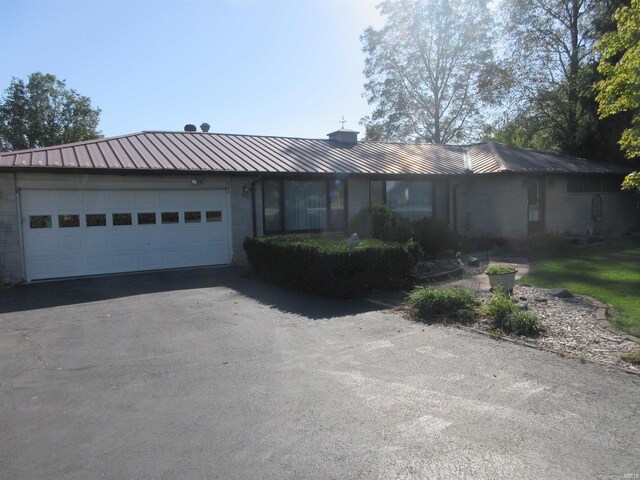 single story home featuring a garage