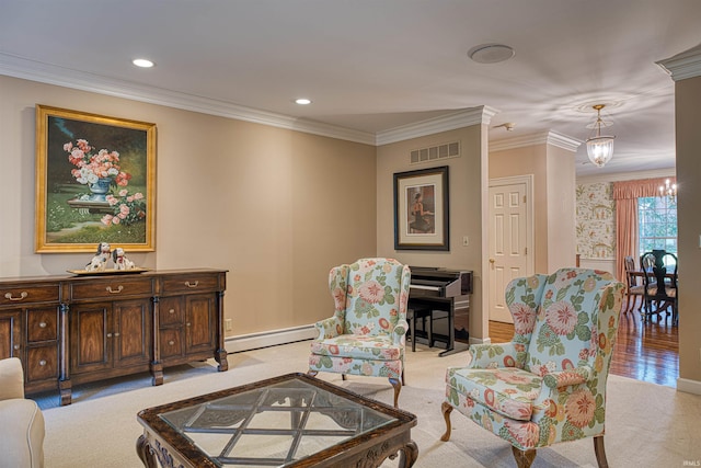 sitting room with light colored carpet, crown molding, a chandelier, and baseboard heating