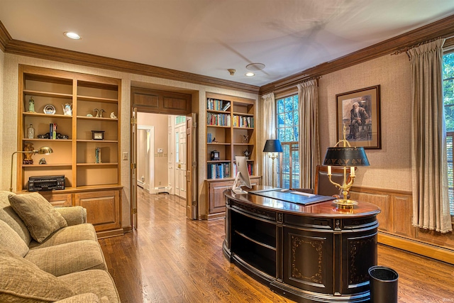 office area featuring ornamental molding, built in features, dark hardwood / wood-style flooring, and a wealth of natural light