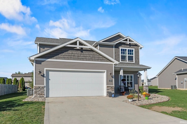 craftsman-style home with a front lawn and central AC unit