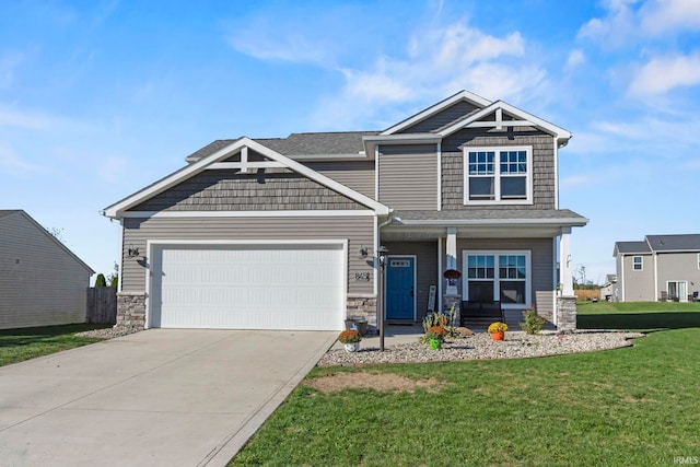 craftsman-style house featuring a front lawn and a garage