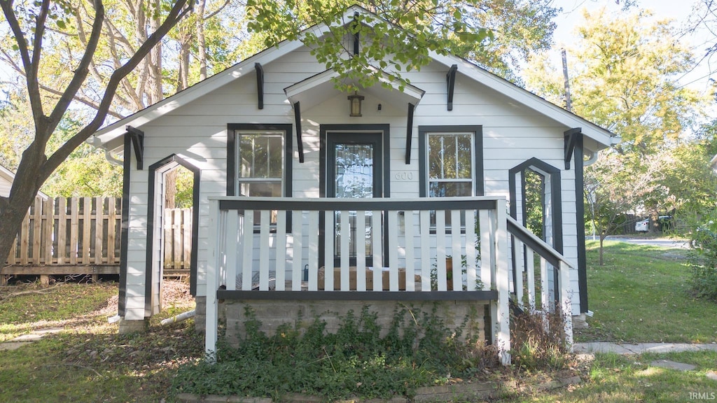 bungalow-style home featuring a front yard