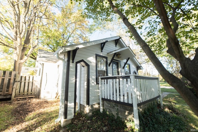 view of side of property with a deck