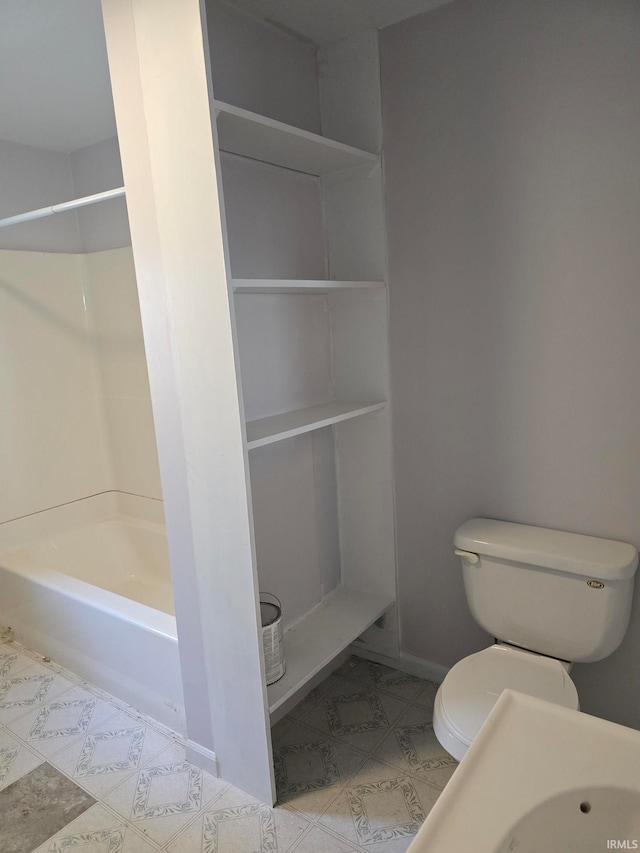 bathroom featuring toilet and shower / washtub combination