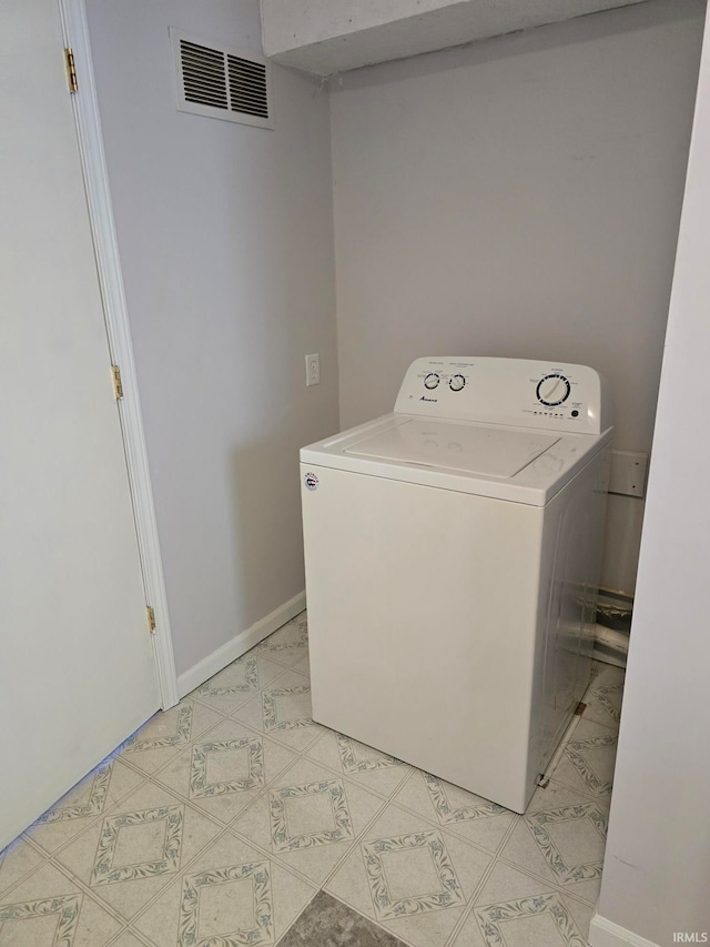 clothes washing area with washer / dryer