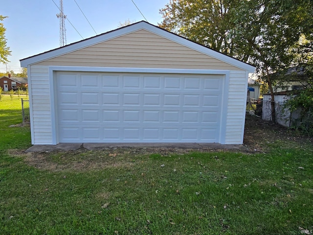 garage featuring a lawn