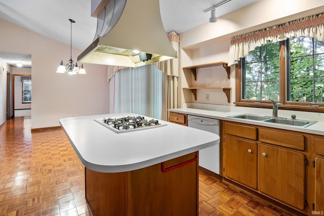 kitchen featuring a kitchen island, white appliances, an inviting chandelier, island exhaust hood, and a textured ceiling