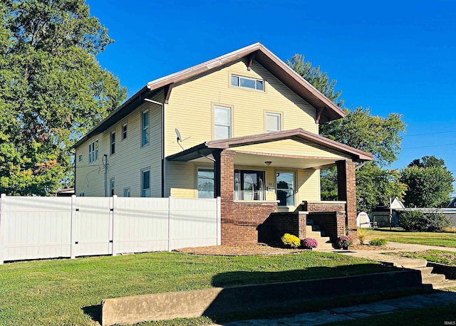 exterior space featuring a yard and covered porch