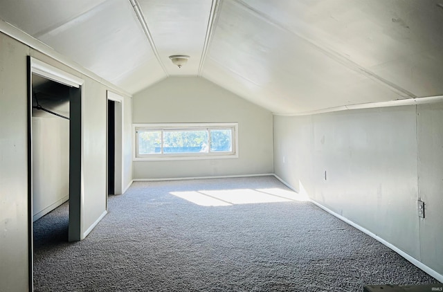 bonus room featuring lofted ceiling and carpet flooring