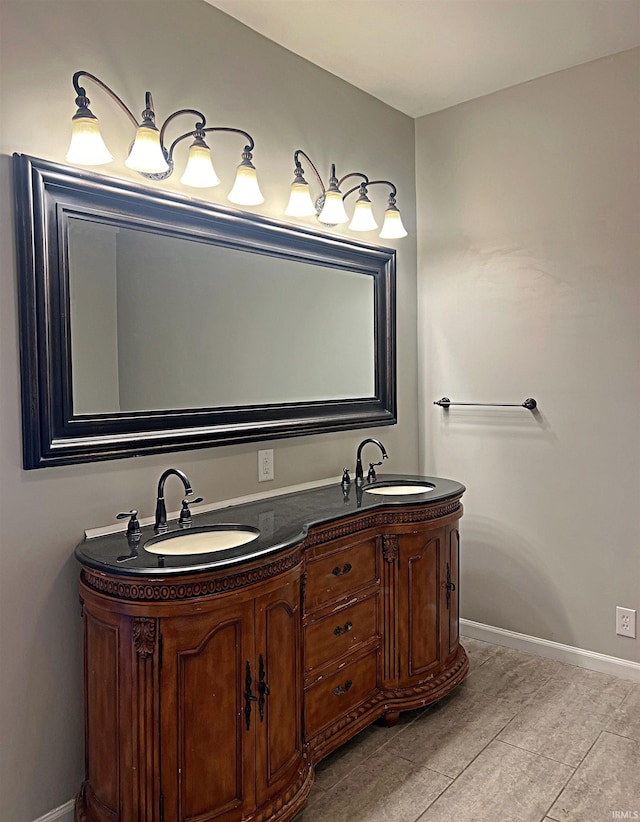 bathroom with tile patterned floors and vanity