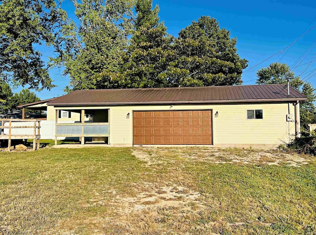 garage with a yard