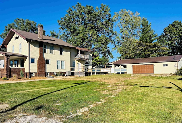 exterior space featuring cooling unit, a balcony, and a lawn